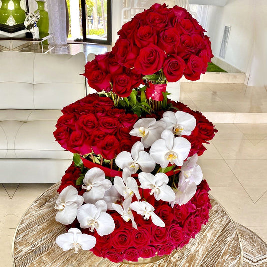 Red Roses and Orchids Valentines arrangement with 4 levels.