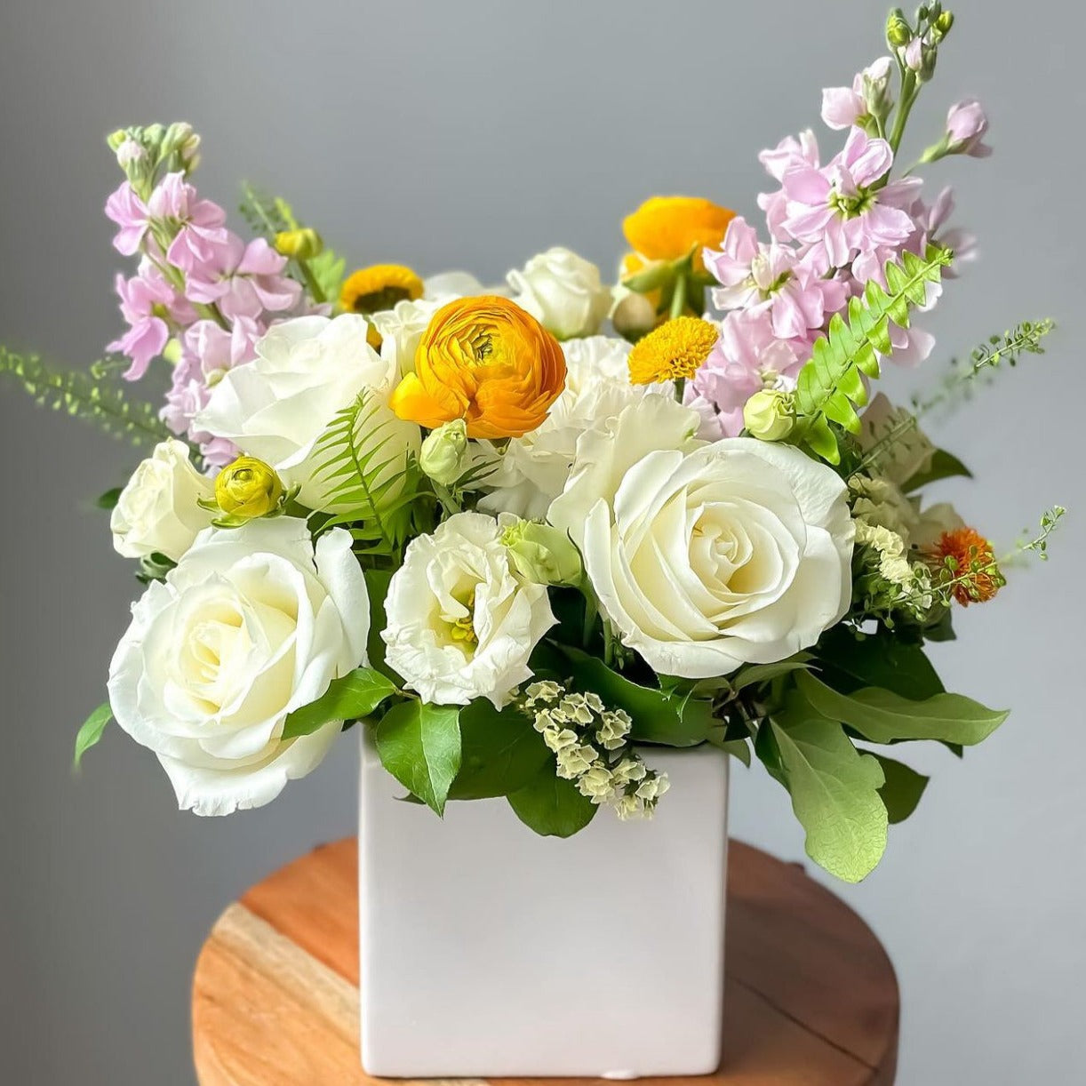 Medium white box with selected fresh cut flowers.